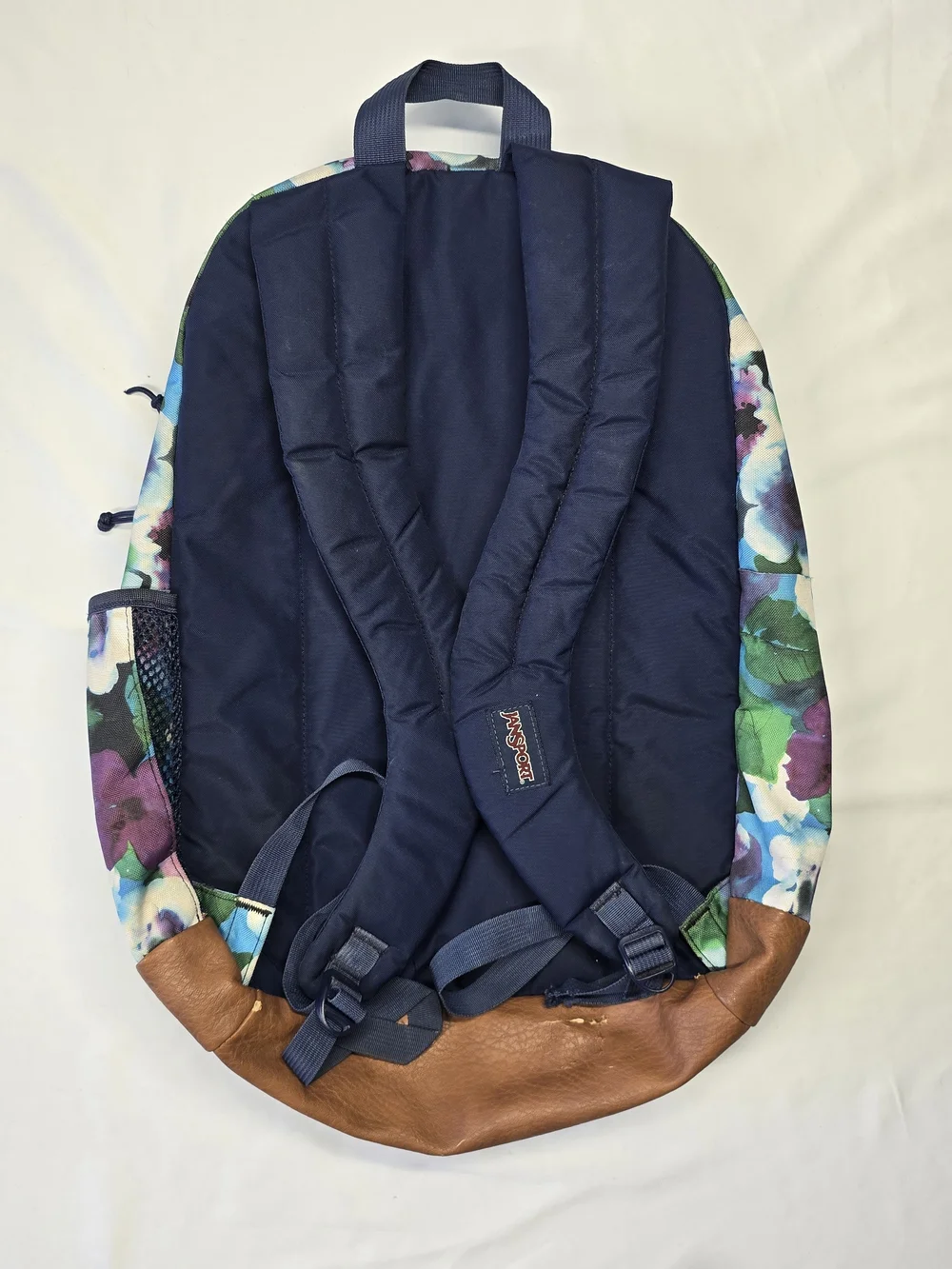 JanSport Floral Watercolor Backpack with Faux Leather Base